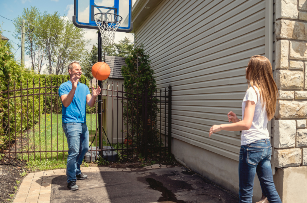 Youth athletes practicing soccer, rugby, volleyball, throws, and archery drills at home.