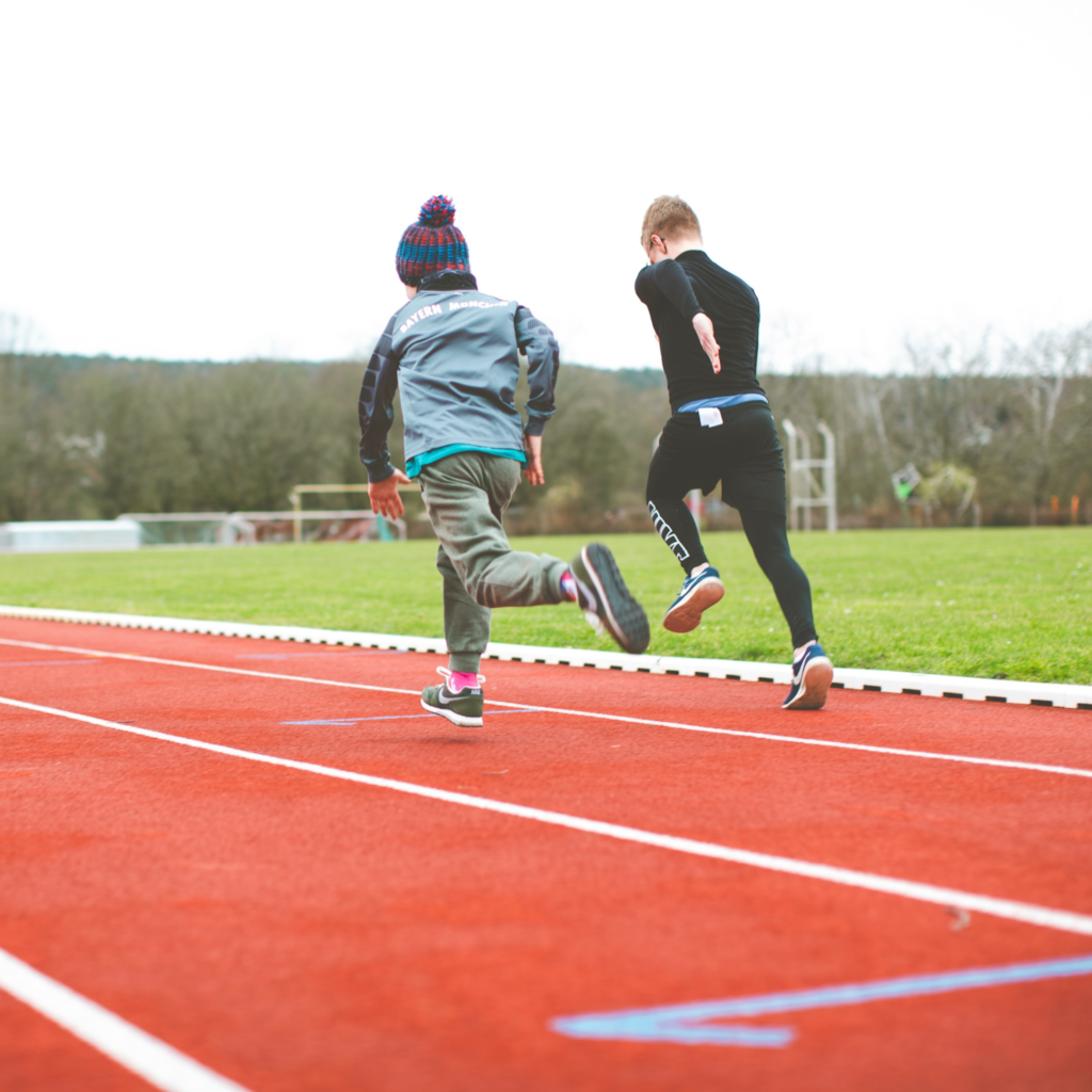 Youth athletes performing speed and agility drills, including sprint starts and ladder footwork exercises, during training at 12th Rock.